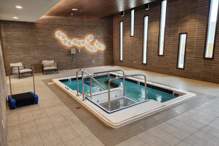 Senior living facility hydrotherapy pool with zero entry lift