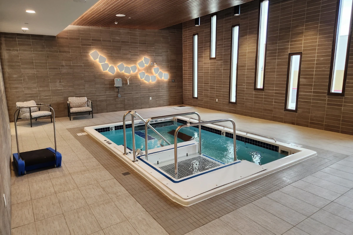 Senior living facility hydrotherapy pool with zero entry lift